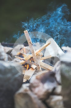 Making a bonfire: Small flame on a camping trip, adventure outdoors photo