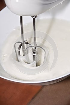 Making a cake: photo catching the movement of an electric whisk used to mixer eggs