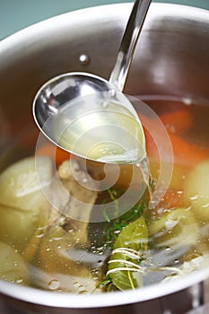 Making chicken bouillon in a pot