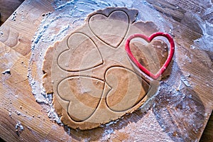 Making christmas gingerbread heart cookie
