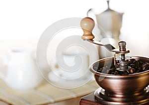 Making coffee. Coffee grinder, coffee cup, coffee moka.