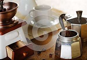 Making coffee. Coffee grinder, coffee cup, coffee moka