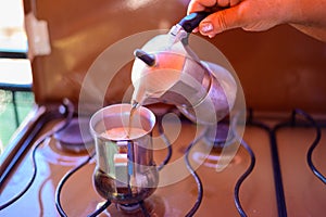 Making coffee with old traditional Italian percolator on gas stove