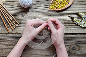 Making crochet bracelet with beads. Needlework accessories for creating crocheted jewelry. Step 1 - crochet strap for bracelet or
