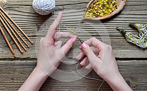 Making crochet bracelet with beads. Needlework accessories for creating crocheted jewelry. Step 1 - crochet strap for bracelet or