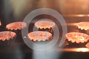 Making cupcakes, baking process. Photo from kitchen.