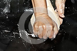 Making dough by female hands