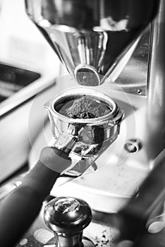 Making espresso coffee close up detail with modern machine