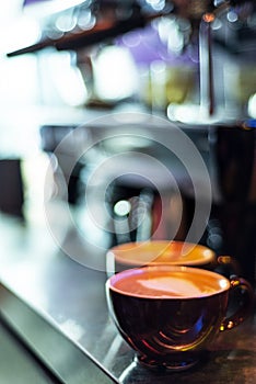 Making espresso coffee close up detail with modern machine