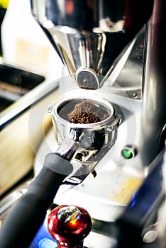 Making espresso coffee close up detail with modern machine
