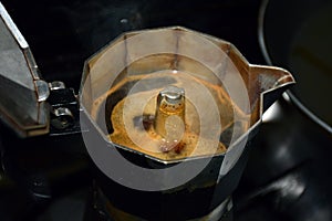 Making espresso in an Italian coffee maker photo