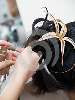 Making evening woman coiffure