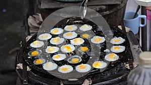 Making fried Quail's egg in the boiling pan