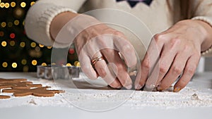 Making gingerbread cookies for Christmas at home. The process of making ginger cookies. Girl`s hands close-up prepares