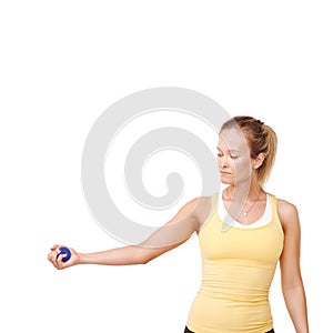 Making good use of her stress ball. Cropped view of a woman squeezing a stress ball against a white background.