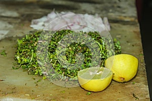Making of Gotukola Sambol / Gotukola salad with onion and lime