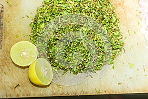 Making of Gotukola Sambol / Gotukola salad with onion and lime