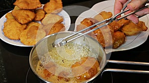 Making grandmother`s cakes a homemade sweet fried with honey photo
