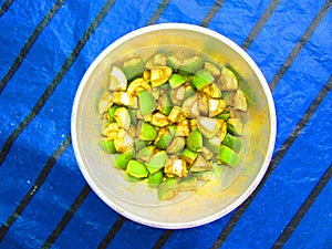 Making of green Mango pickel.