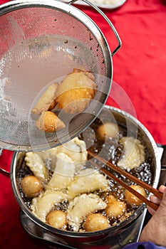 making Guangdong-style crispy pastry dumplings for Chinese New Year vertical composition photo