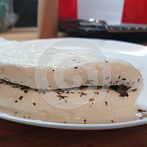 Making halumi cheese with your own hands. Step-by-step photos of the process. Haloumi cheese head, bent in half and