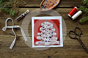 Making of handmade christmas greeting card from felt with your own hands. Children& x27;s DIY concept. Making xmas decoration