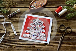 Making of handmade christmas greeting card from felt with your own hands. Children& x27;s DIY concept. Making xmas decoration