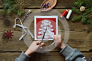 Making of handmade christmas greeting card from felt with your own hands. Children`s DIY concept. Making xmas decoration. Step 1.