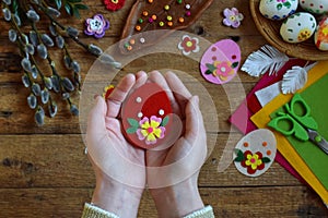 Making of handmade easter eggs from felt with your own hands. Children DIY concept. Making Easter decoration or greeting card.