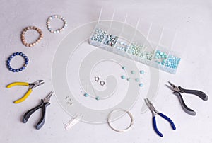 Making of handmade jewellery. Top view. Beads, tools for creating jewelry. Preparation for handmade. Create jewelry, bracelets