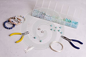 Making of handmade jewellery. Top view. Beads, tools for creating jewelry. Preparation for handmade. Create jewelry, bracelets