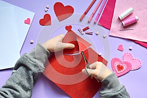 Making of handmade Valentine greeting card from felt. Childrens DIY, hobby concept, gift with your own hands. Valentine& x27;s Day