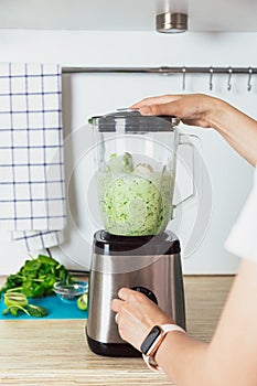 Making a healthy green smoothie from fruits and vegetables. Diet, healthy eating, vegan food