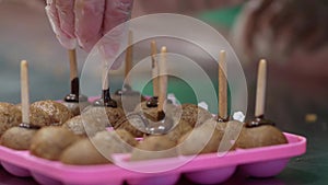 making homemade candy sticks. putting the candy in a silicone mold. close up