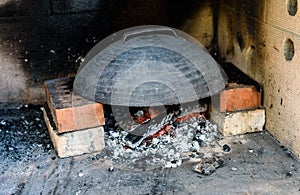 Making of homemade Italian pizza in fireplace brick oven