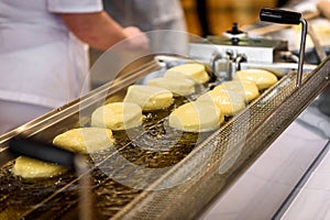 Making homemade jam doughnuts in a professional restaurant buff