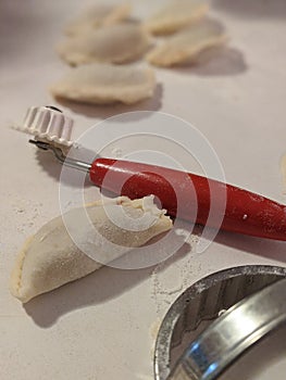 Making homemade pierogies using tools