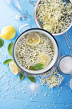 Making homemade syrup drink with fresh elder flowers