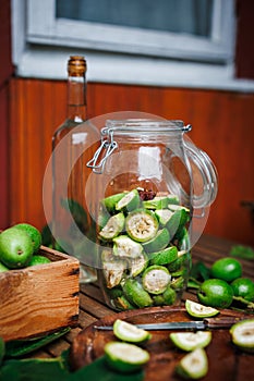 Making homemade walnut liqueur from unripe nuts