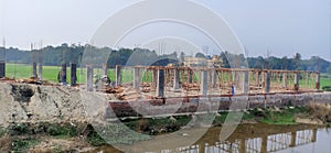 Making house by bamboo structure and working Yong man upfront of highway at fulprash darbhanga bihar india photo