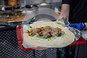making a kebab in a restaurant chicken salad in rollo