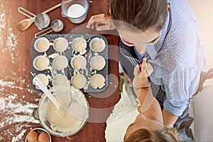 Making kitchen memories. a mother and her daughter baking in the kitchen.