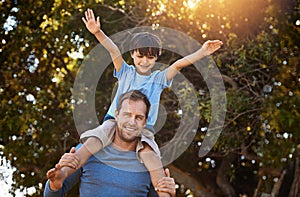 Making memories every day. Portrait of a father and his young son spending quality time together outside.