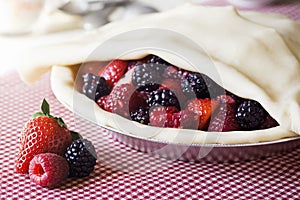 Making a Mixed Berry Pie: Covering the Berries with Uncooked Crust