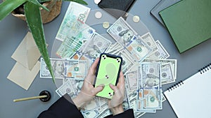 Making money online. Internet investments. Businesswoman using mobile app for investing. Online casino winning, winning on financi