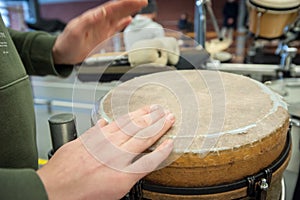 Making music with djembe and drumming hands