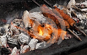 Making mutton kababs or kebabs on coal fired arrangement