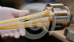 Making noodles with pasta machine from homemade spelt dough.