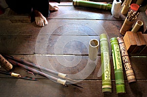 Making ornate bamboo quiver for blowpipe darts on Borneo photo