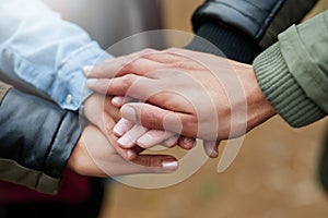 Making a pact to stay friends forever. Closeup shot of a group of friends with their hands together in unity.